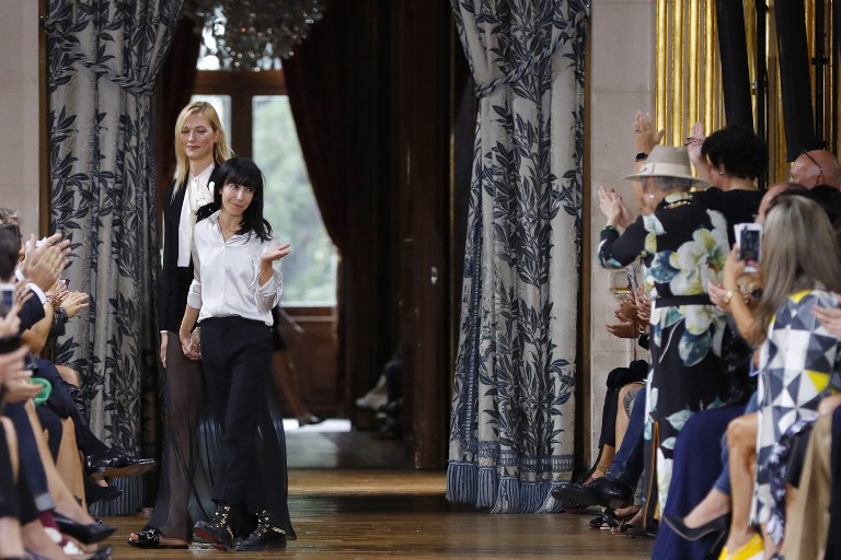 French fashion designer Bouchra Jarrar for Lanvin acknowledges the audience at the end of the show (Credit: Patrick Kovarik / AFP Photo)